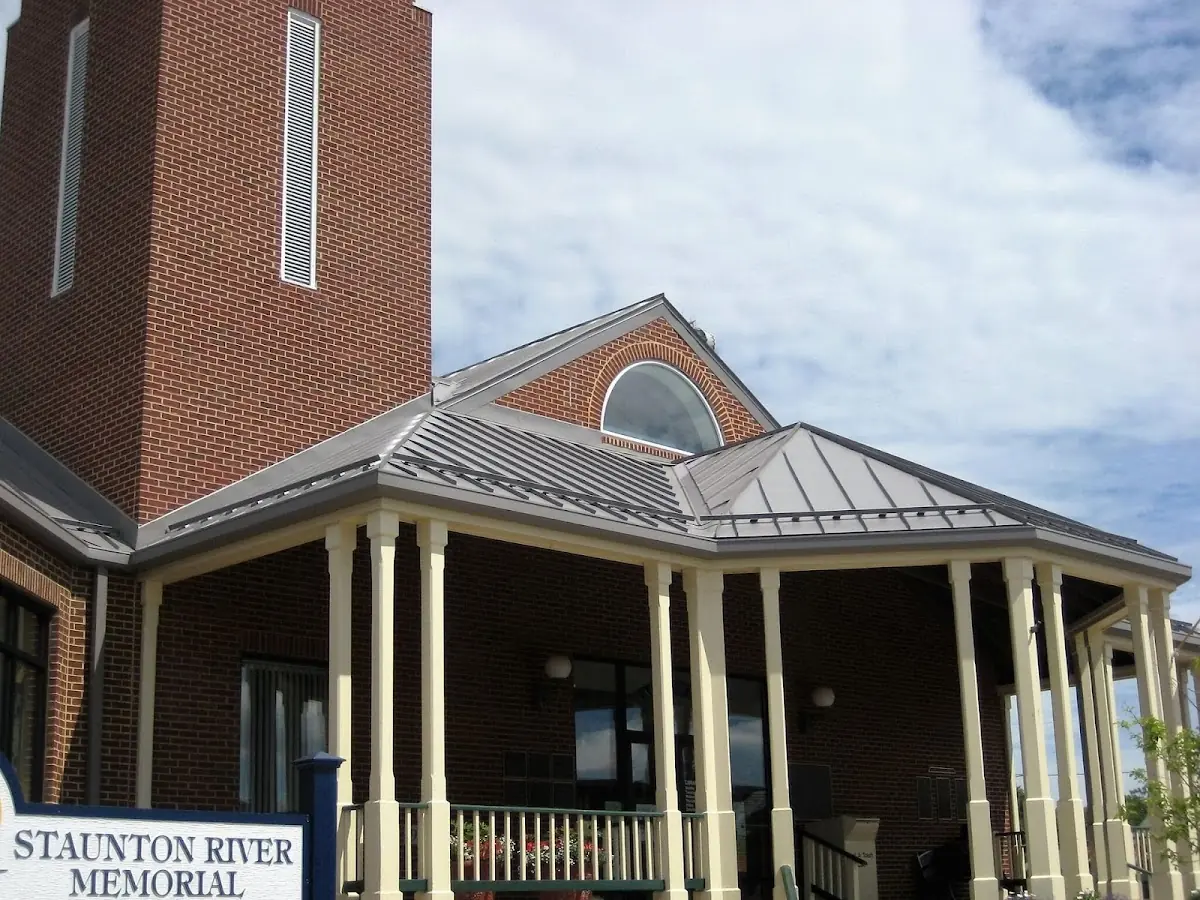 Skilled roofing craftsmen working on a residential roof in Three Rivers
